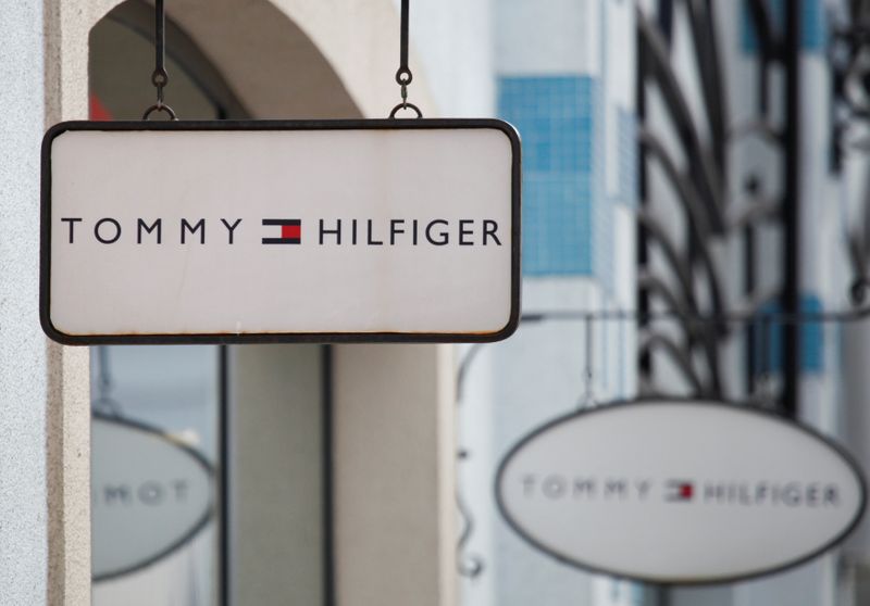 Boards with Tommy Hilfiger store logo are seen on a