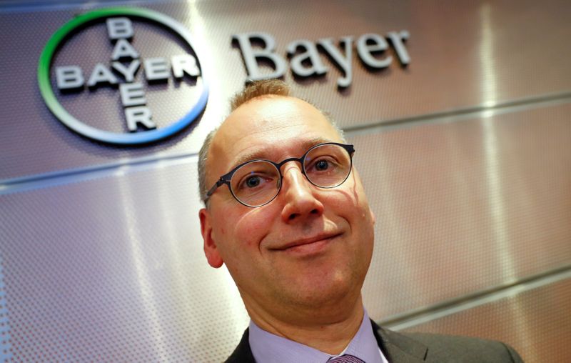 FILE PHOTO: Bayer CEO Baumann is posing in front of