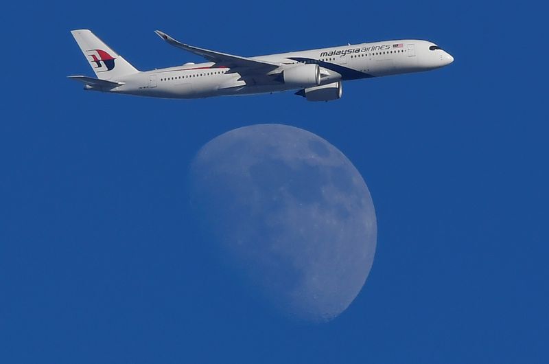 A Malaysian Airlines Airbus A350 passenger aircraft is seen flying