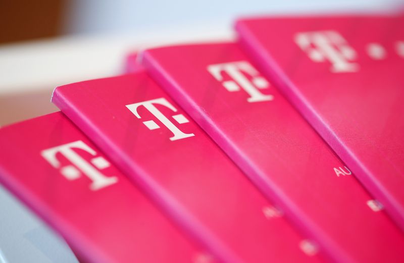 Brochures with the logo of Deutsche Telekom AG are pictured
