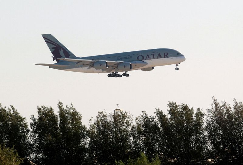 FILE PHOTO: Qatar Airways Airbus A380 plane is seen over