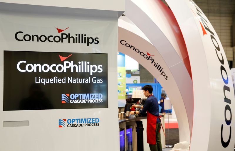 FILE PHOTO: Logos of ConocoPhillips are seen in its booth