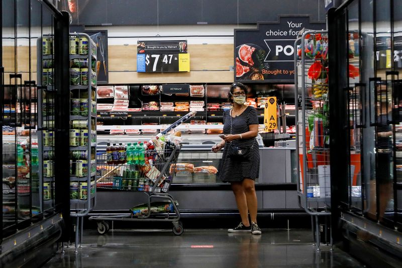 FILE PHOTO: A shopper is seen wearing a mask while