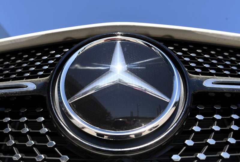 FILE PHOTO: The Mercedes-Benz logo is seen near the Daimler