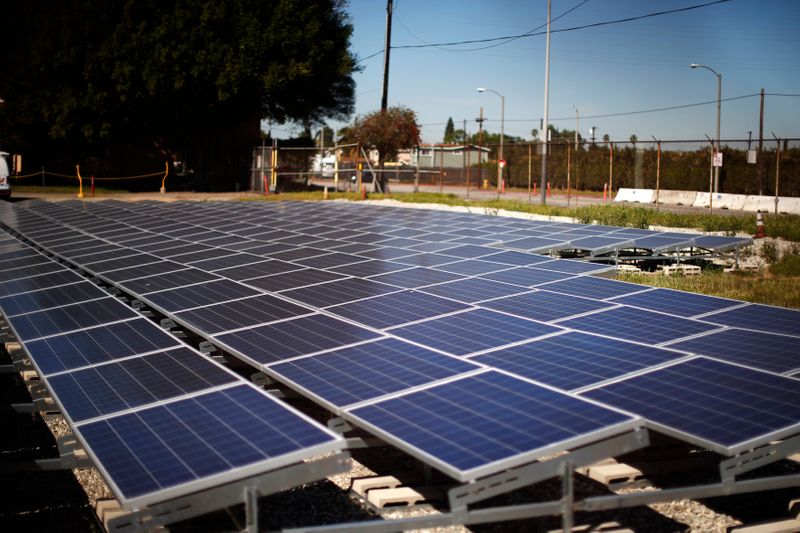 Solar panels are seen next to a Southern California Edison