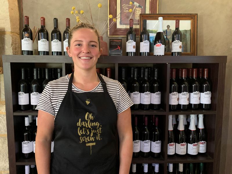 Australian winemaker Savannah Peterson stands at her cellar door in