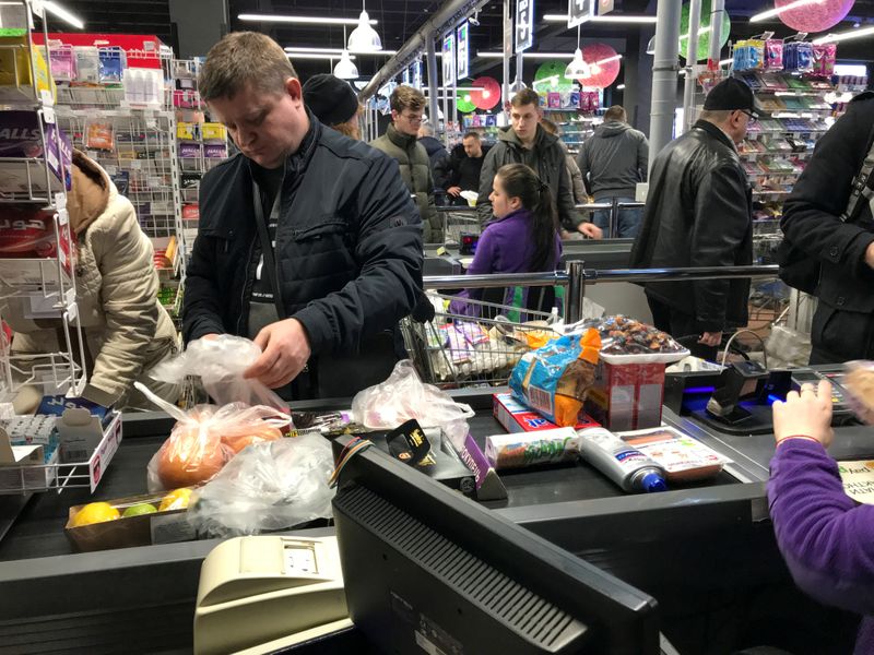 FILE PHOTO: Customers visit a supermarket in Kiev