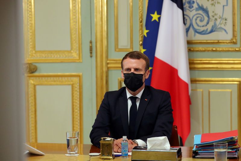FILE PHOTO: French President Emmanuel Macron attends a video conference
