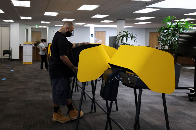 FILE PHOTO: Michael Gonzales, 35, votes at the Uber Hub