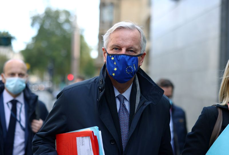 FILE PHOTO: European Union’s Brexit negotiator Michel Barnier walks at