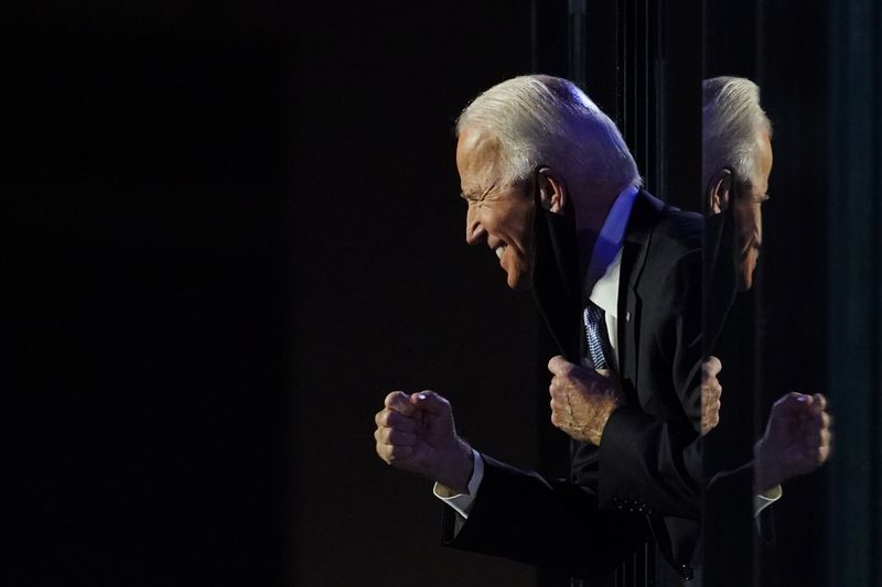 Democratic 2020 U.S. presidential nominee Joe Biden celebrates onstage at