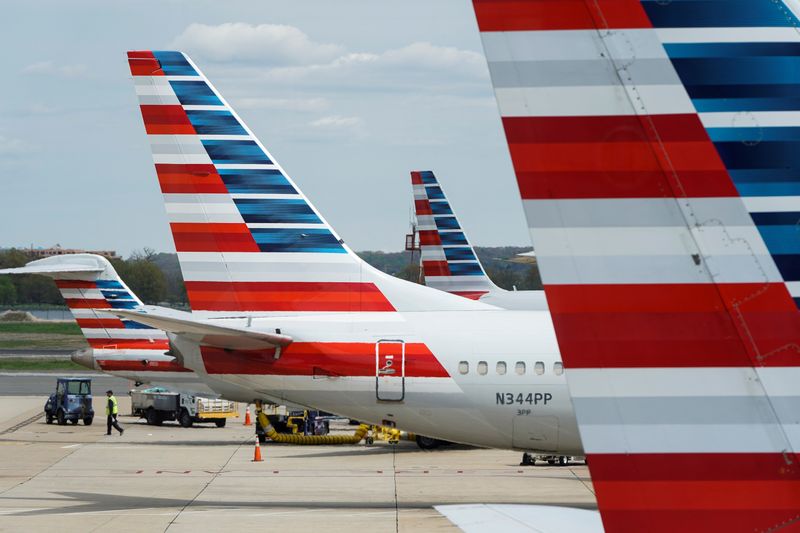 American Airlines planes are parked at the gate during the
