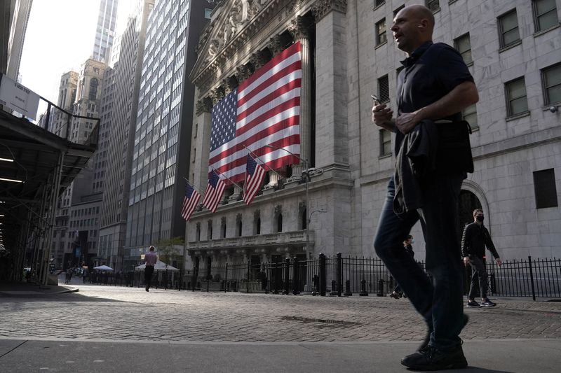 People walk past the New York Stock Exchange