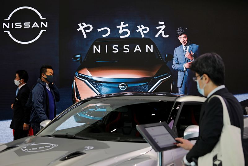 Visitors are seen at Nissan Motor Corp.’s showroom in Tokyo