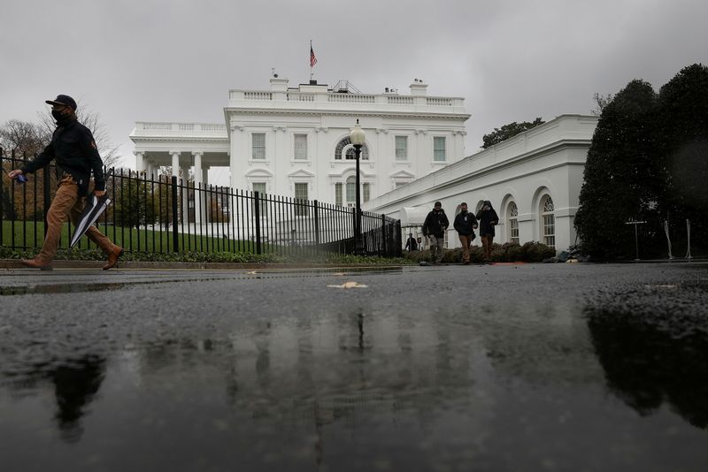FILE PHOTO: Rain falls over the White House during a