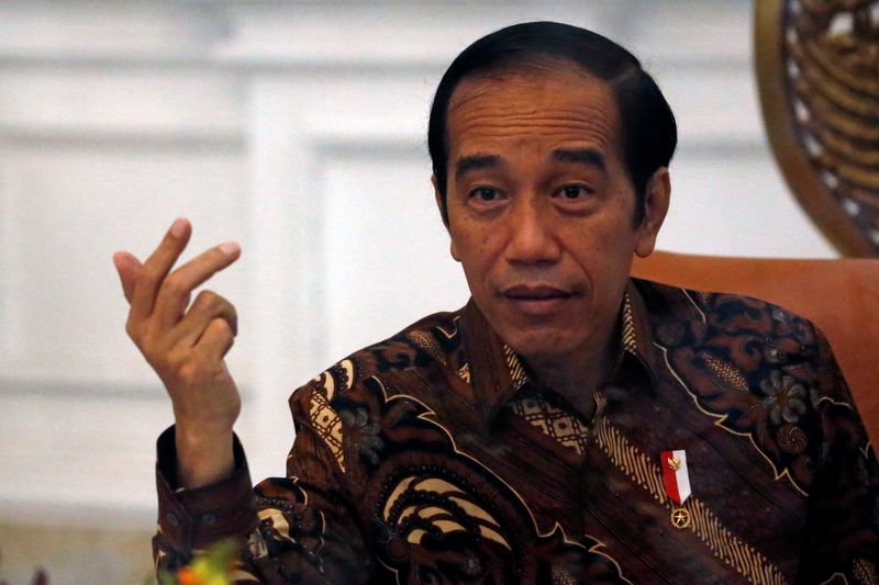 Indonesian President Joko Widodo gestures during an interview with Reuters