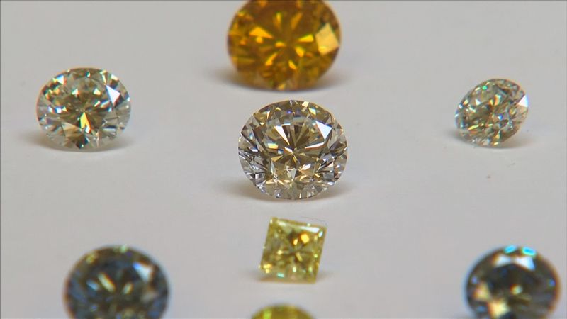 A still image from video shows coloured synthetic diamonds on