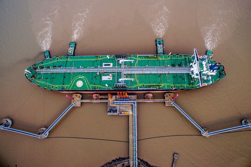 FILE PHOTO: Oil tanker unloads crude oil at a crude