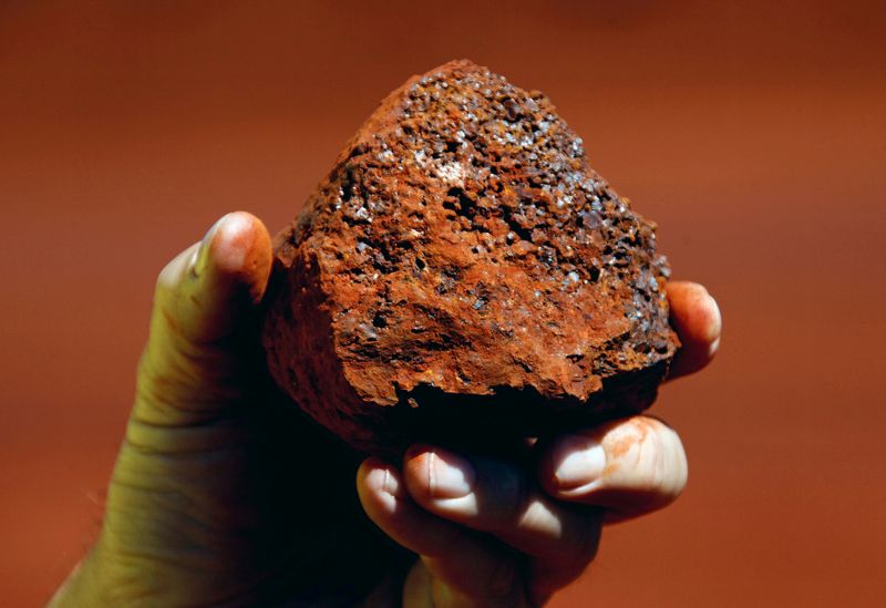 FILE PHOTO: File photo of a miner holding a lump