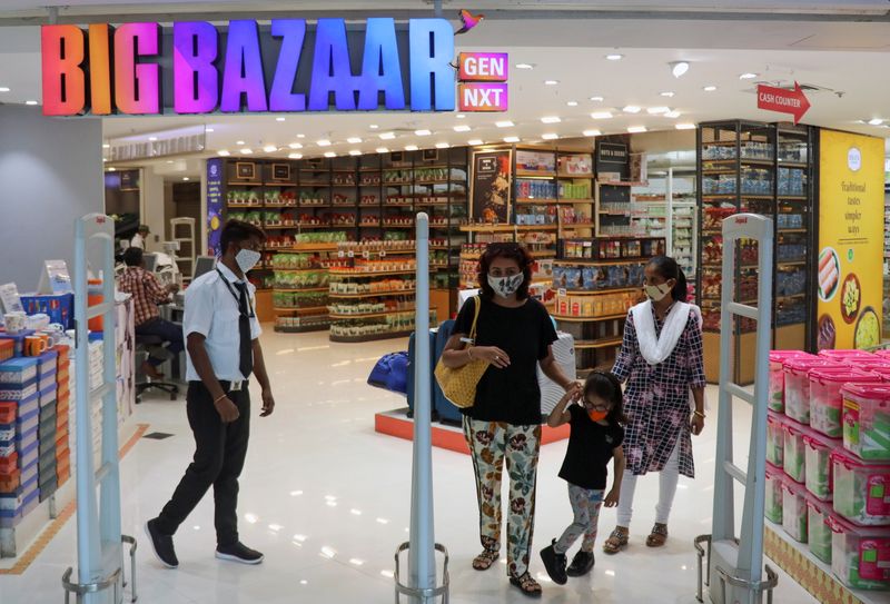 People exit the Big Bazaar retail store in Mumbai