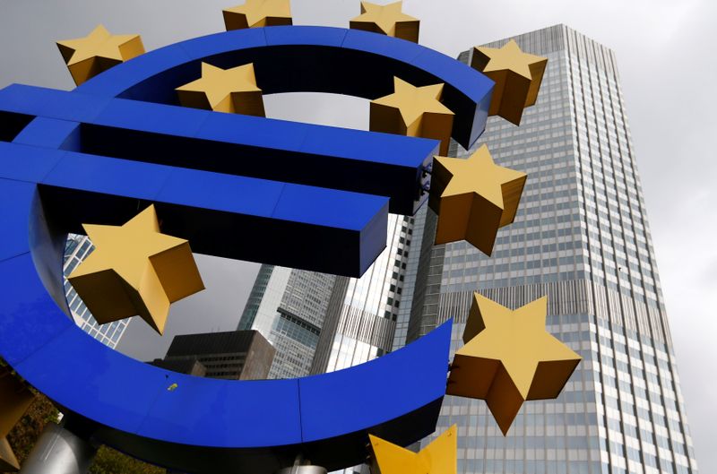 FILE PHOTO: A euro logo sculpture stands in front the