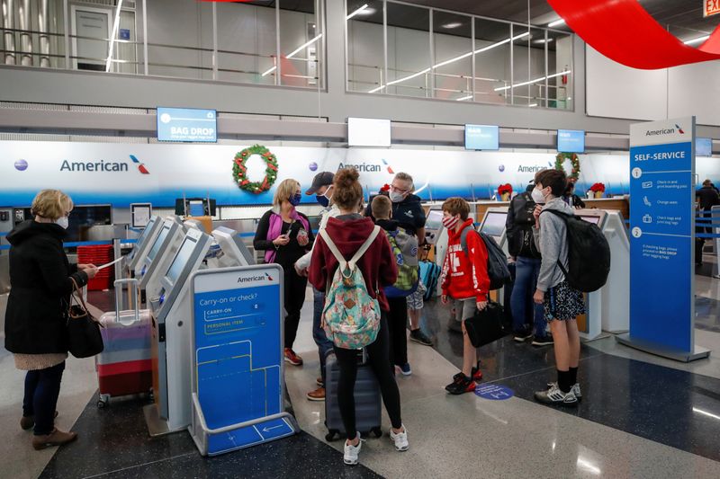 FILE PHOTO: Travelers at O’Hare International Airport ahead of the