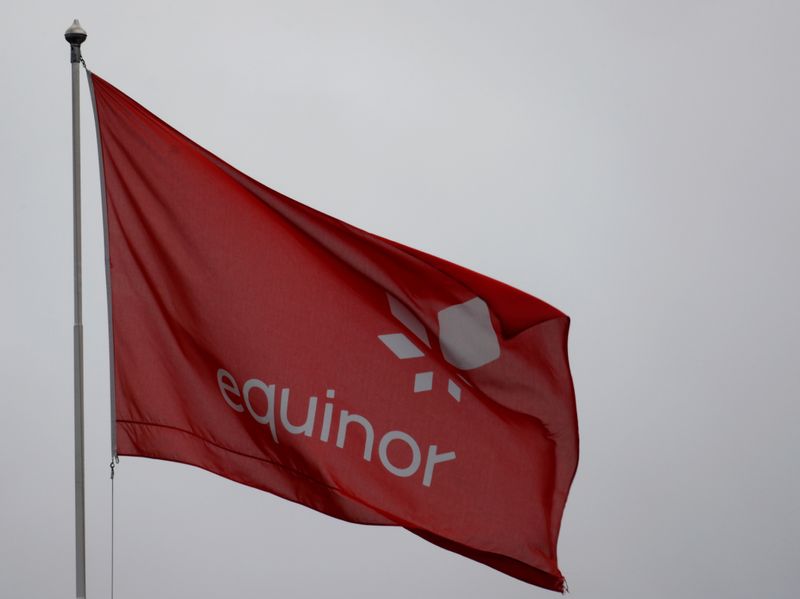 FILE PHOTO: Equinor’s flag flutters next to the company’s headquarters