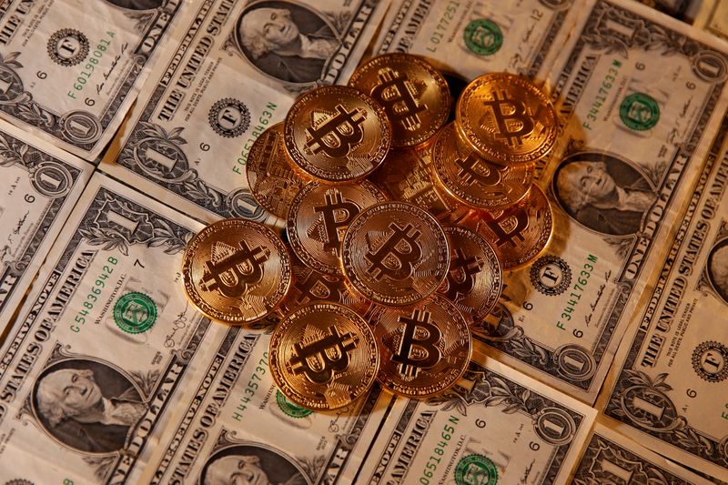 FILE PHOTO: Representations of virtual currency Bitcoin and U.S. dollar