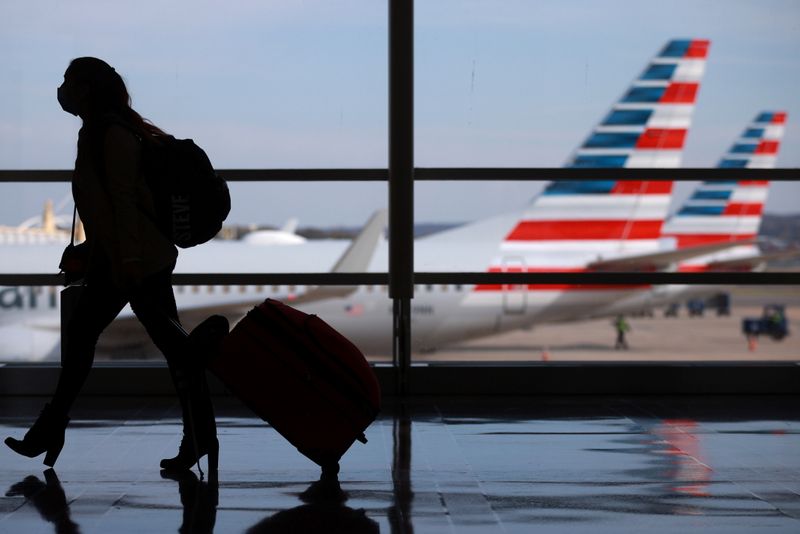 A person walks at Reagan National Airport ahead of the