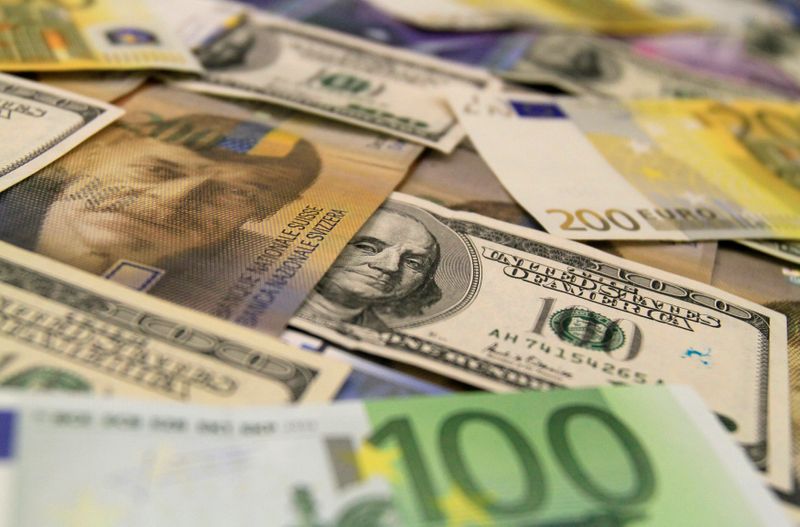U.S. dollar, euro and Swiss franc bank notes are seen