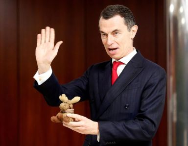 FILE PHOTO: Unicredit bank CEO Mustier holds his mascot Elkette