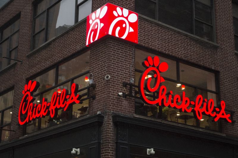 A franchise sign is seen above a Chick-fil-A freestanding restaurant