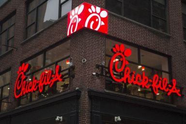 A franchise sign is seen above a Chick-fil-A freestanding restaurant