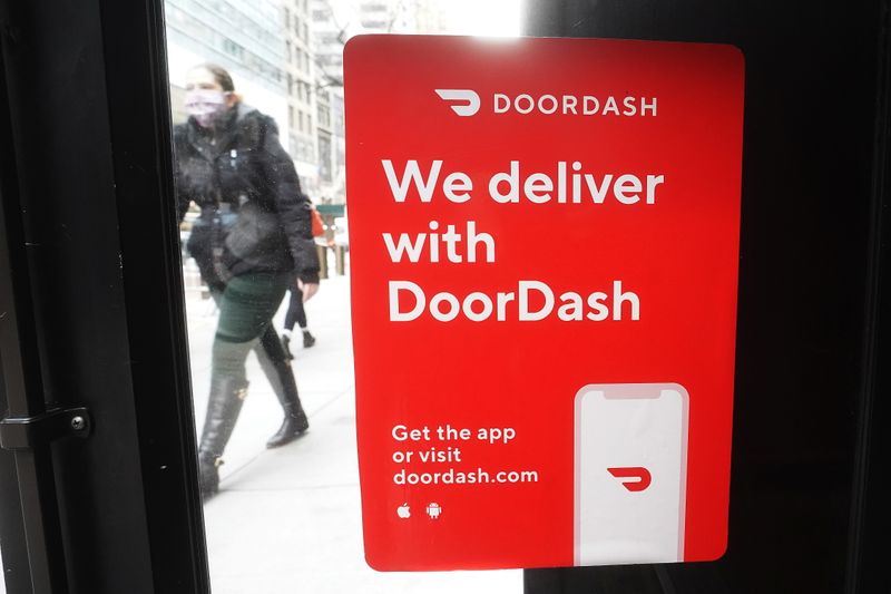 A DoorDash sign is pictured on a restaurant on the