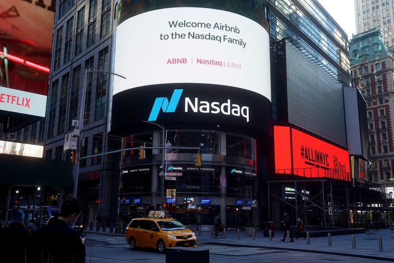 The NASDAQ market site displays an AirBnb sign on their