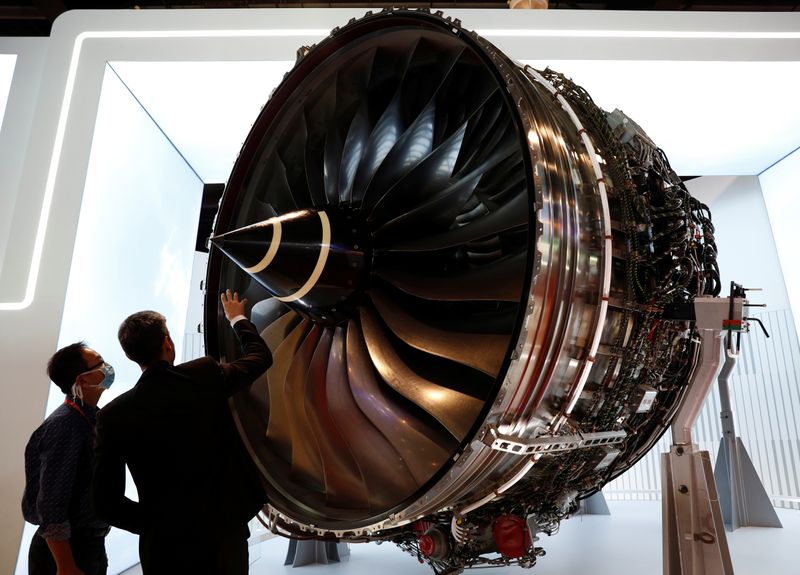 A man looks at Rolls Royce’s Trent Engine displayed at