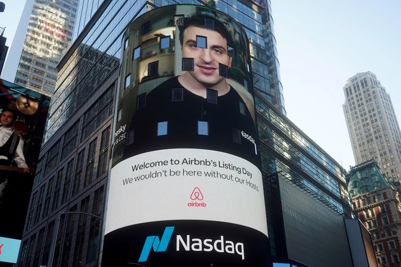 FILE PHOTO: The Nasdaq market site displays an Airbnb sign