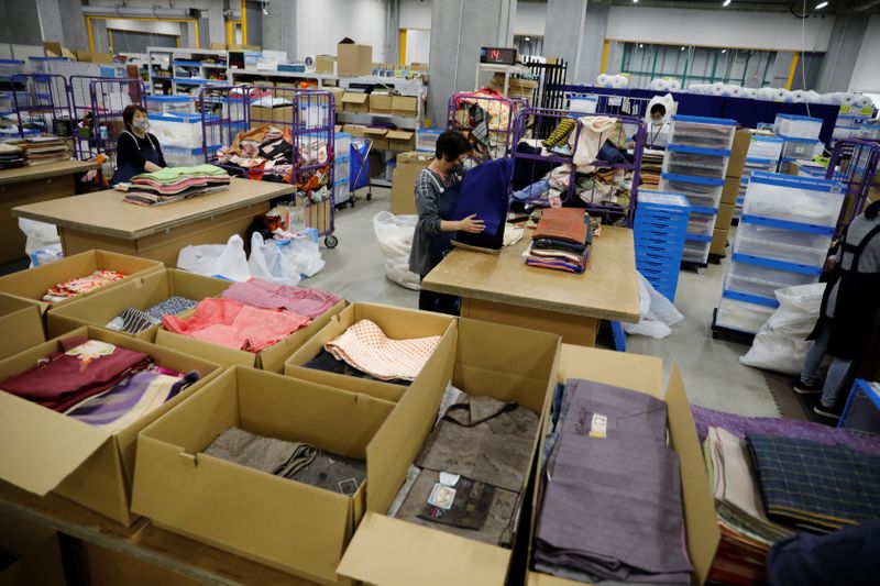 Workers of Buysell Technologies sort kimonos bought from private sellers