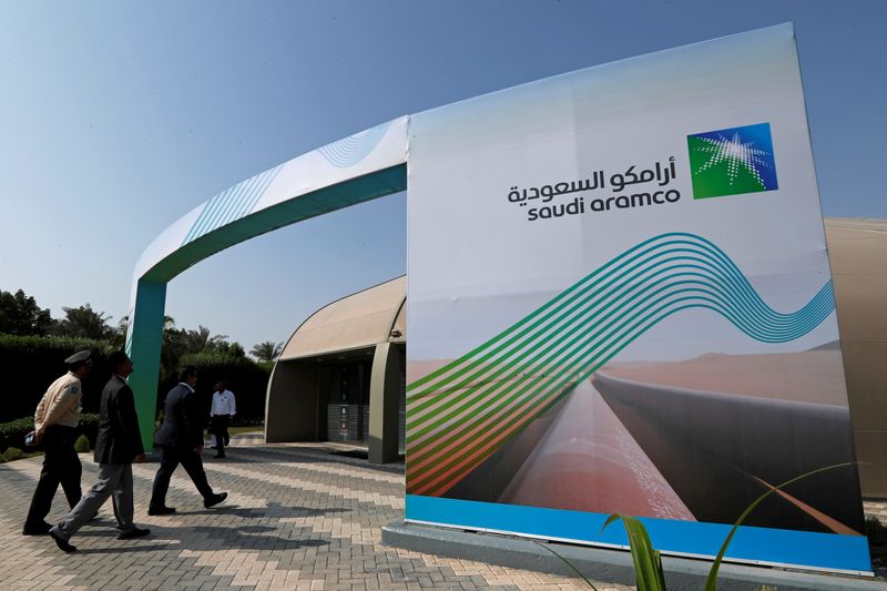 FILE PHOTO: Logo of Aramco is seen as security personnel