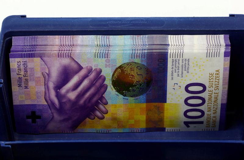 FILE PHOTO: 1,000-Swiss-franc banknotes lie in a box at a