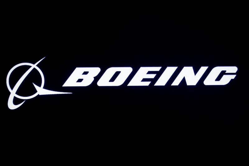 The Boeing logo is displayed on a screen, at the