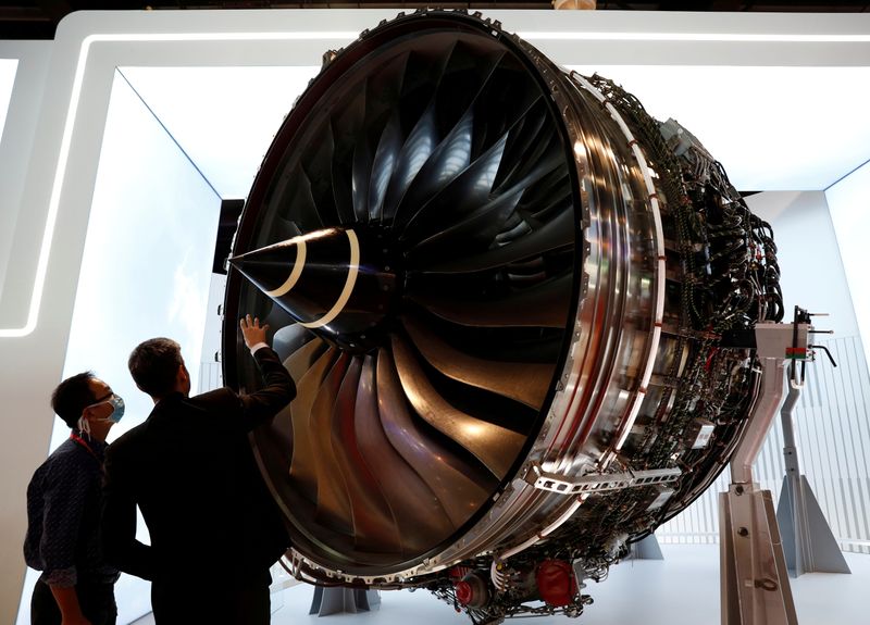 FILE PHOTO: A man looks at Rolls Royce’s Trent Engine