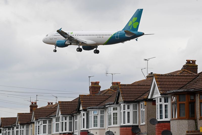 An Aer Lingus flight makes its landing approach at Heathrow