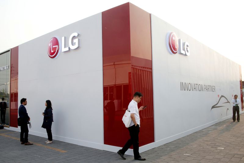 FILE PHOTO: Visitors walk past the showroom of LG Electronics