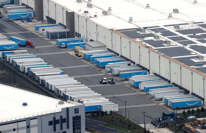 Amazon.com trucks are seen at an Amazon warehouse in Staten