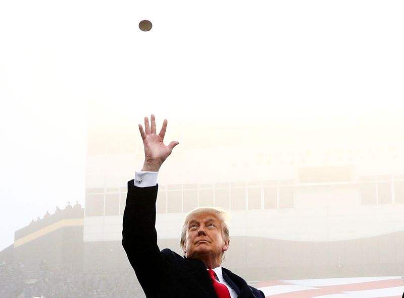 FILE PHOTO: U.S. President Trump participates in a pre-game coin