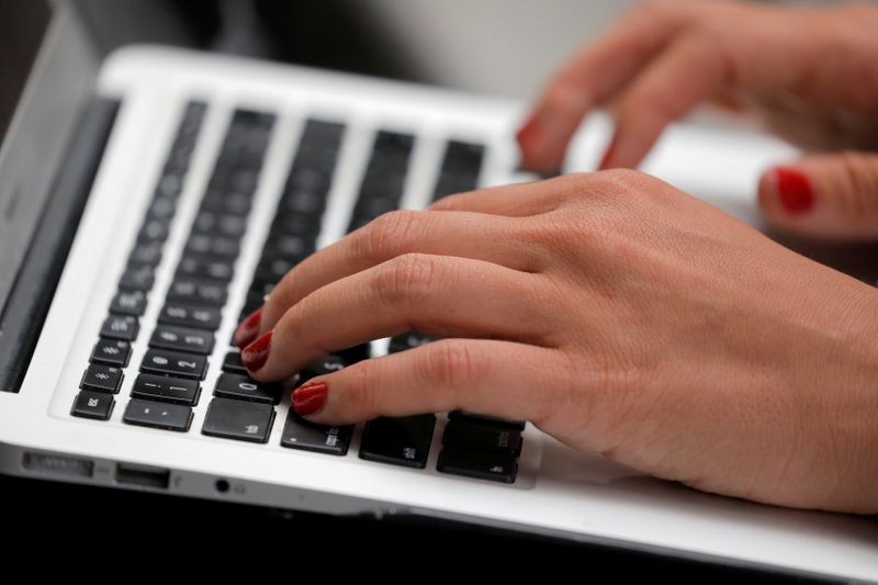 FILE PHOTO: A person types on a laptop computer in