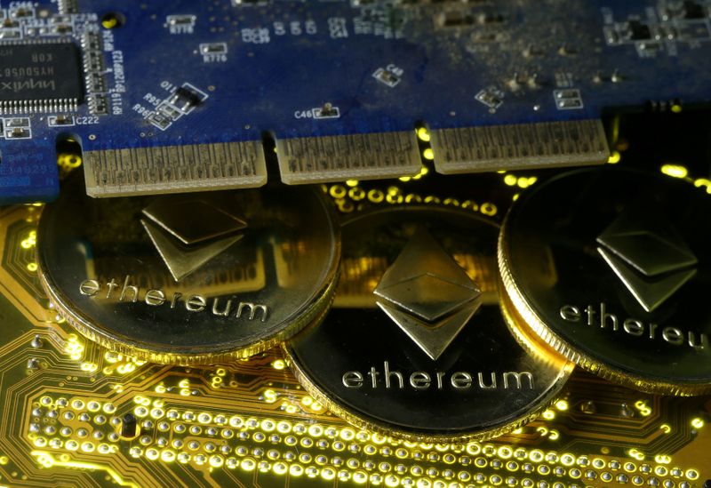 FILE PHOTO: Representations of the Ethereum virtual currency standing on