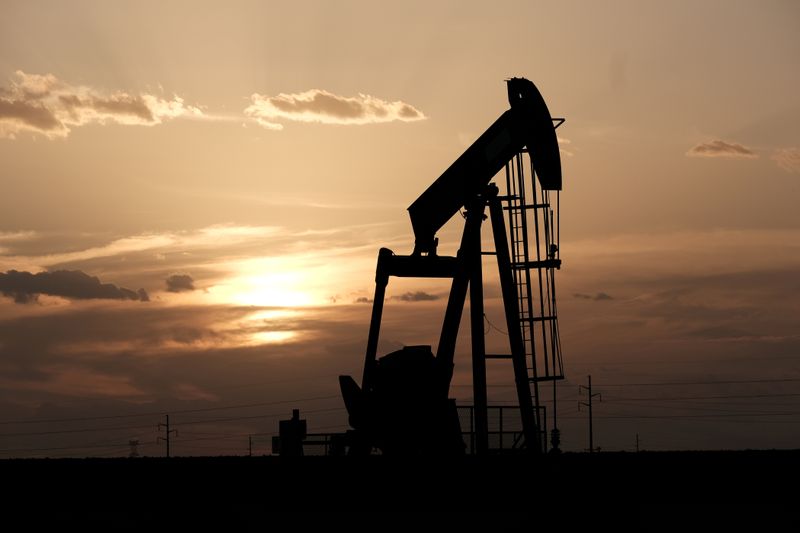FILE PHOTO: Oil pump jacks work at sunset near Midland,