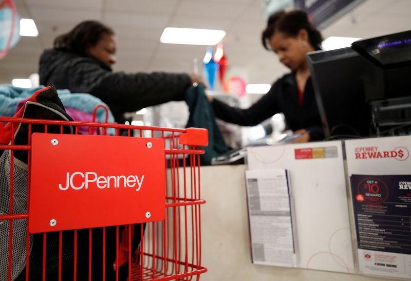 FILE PHOTO: A J.C. Penney employee helps a customer with